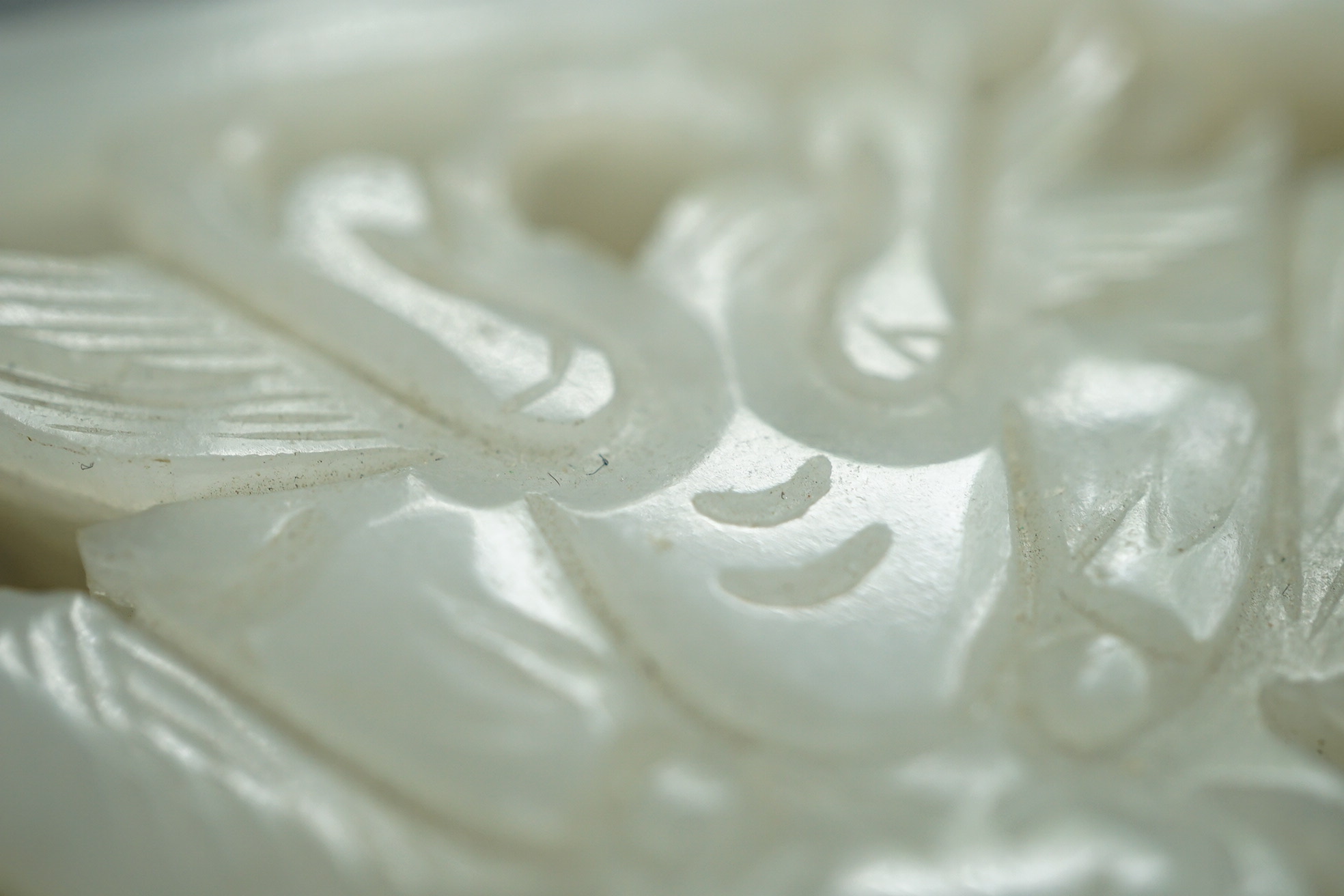 A Chinese white and black jade figure of a recumbent tiger, Song dynasty